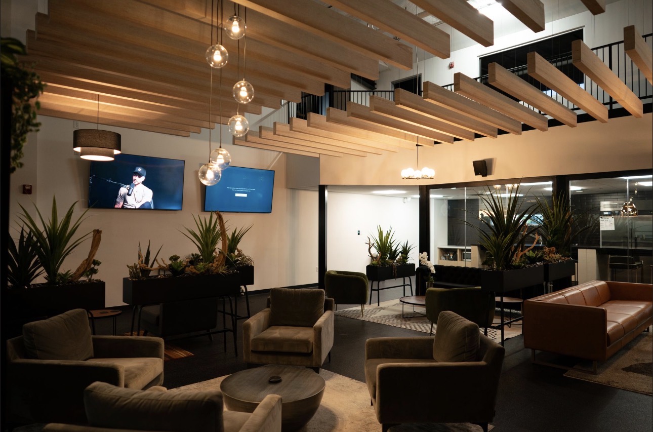 Members lounge with warm wood ceiling and seating