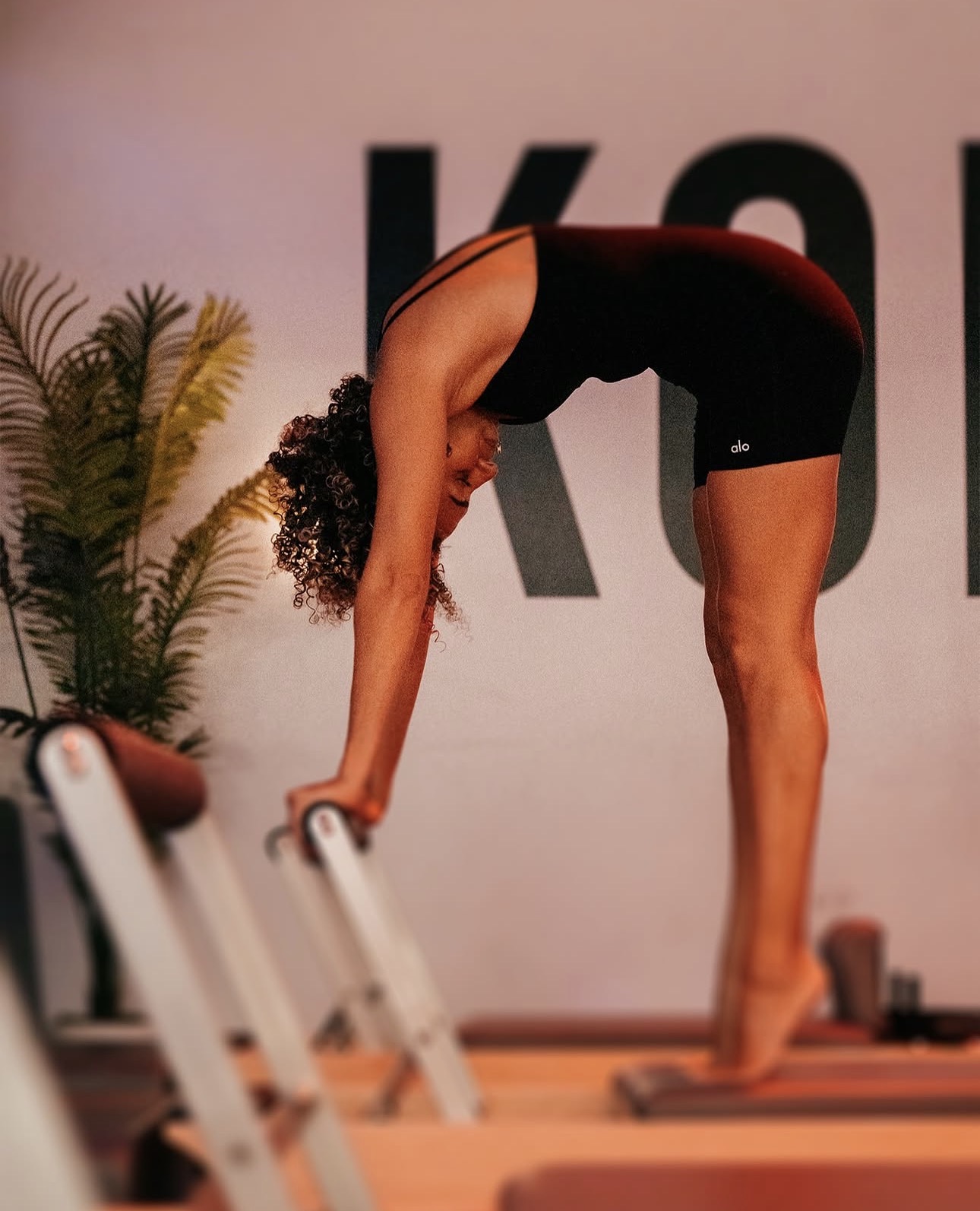 Member on a reformer during a pilates session
